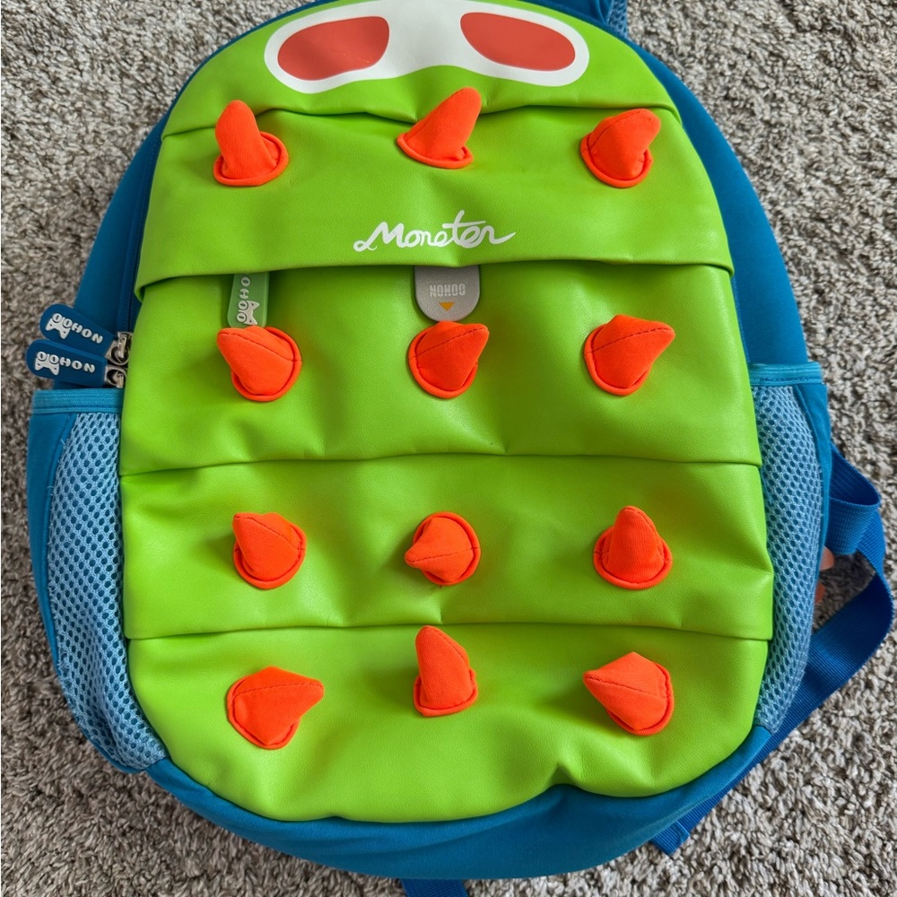 Green and Blue Monster Backpack with Orange Spikes